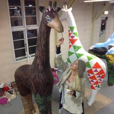 Mandii painting her giraffe - Christchurch Stands Tall