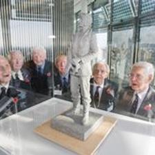 Sir Keith Park maquette surrounded by members of the Keith Park Memorial Campaign